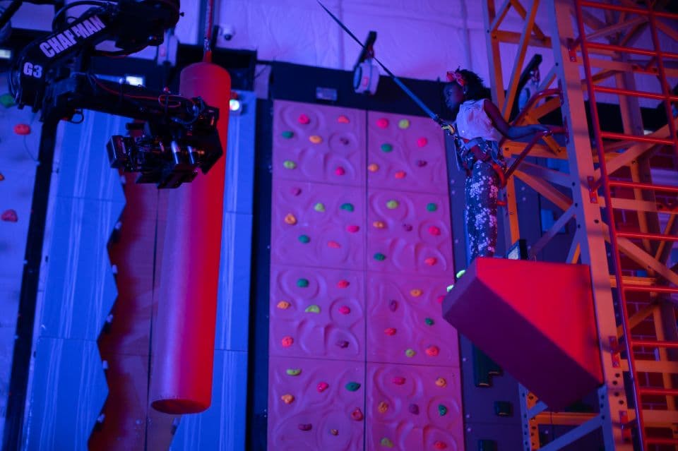 young girl on adventure course at urban air