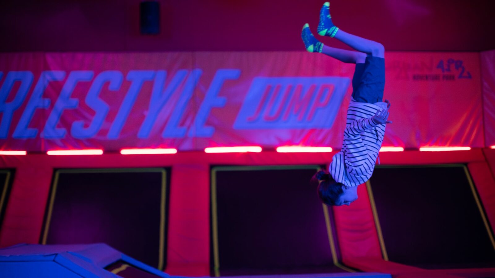 girl flipping on an apex trampoline