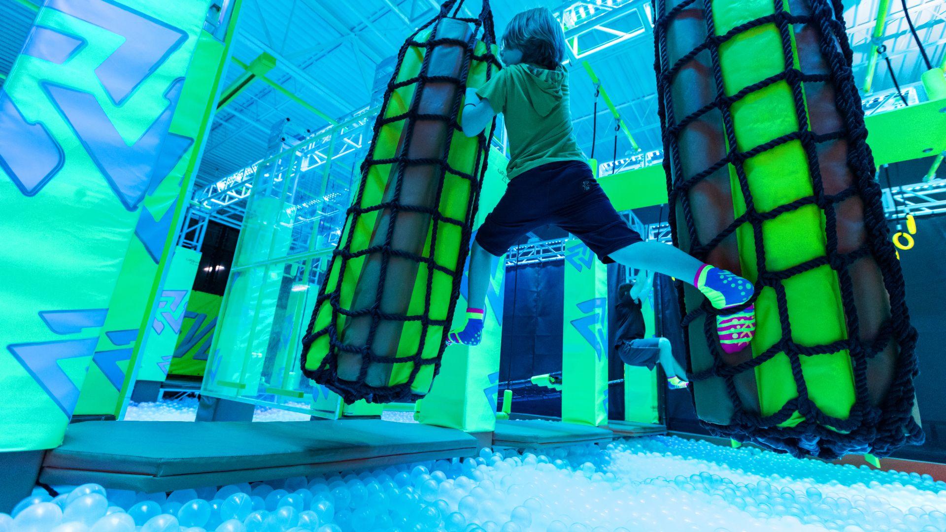 boy on warrior course at urban air