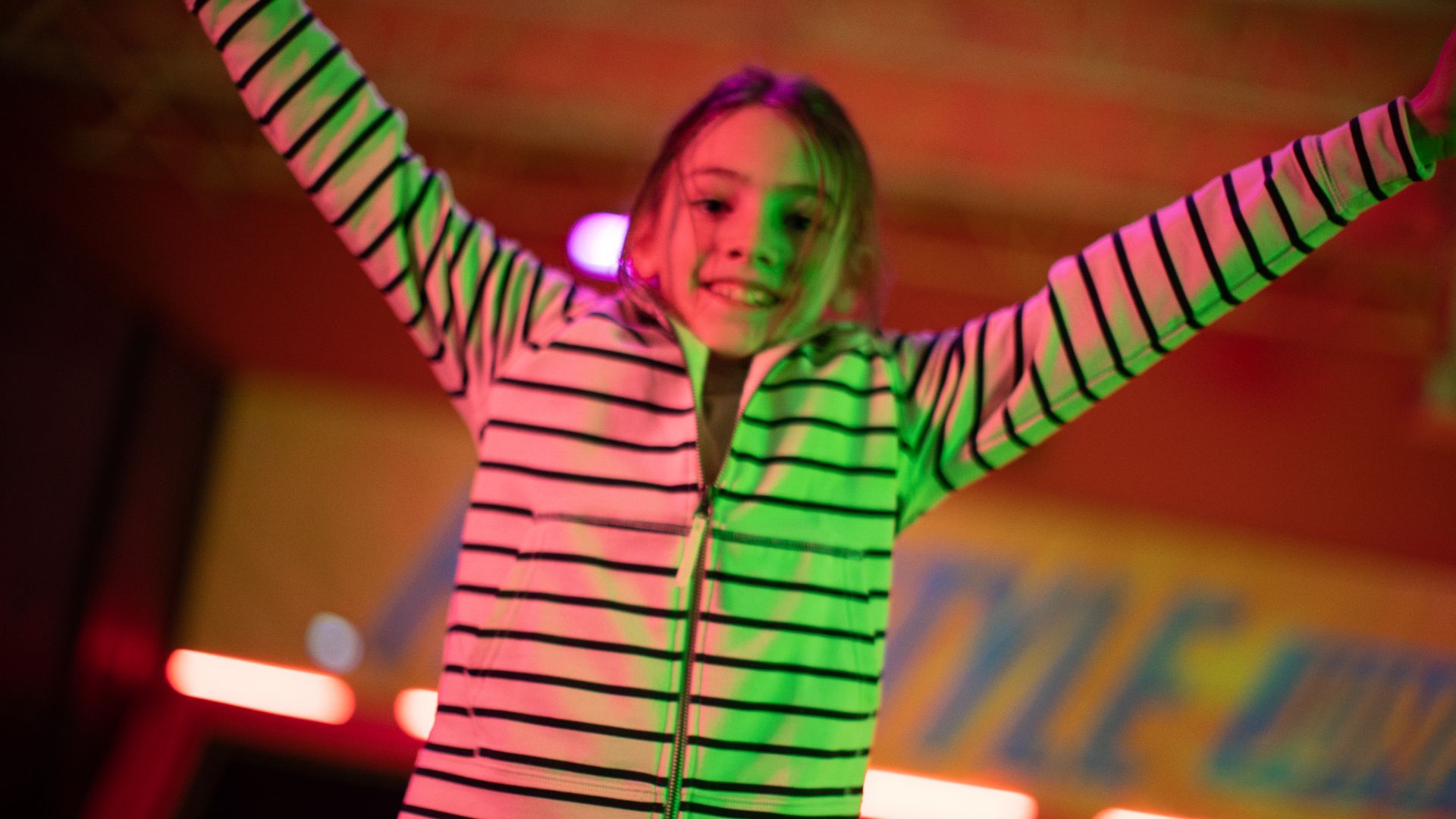 girl on urban air trampoline