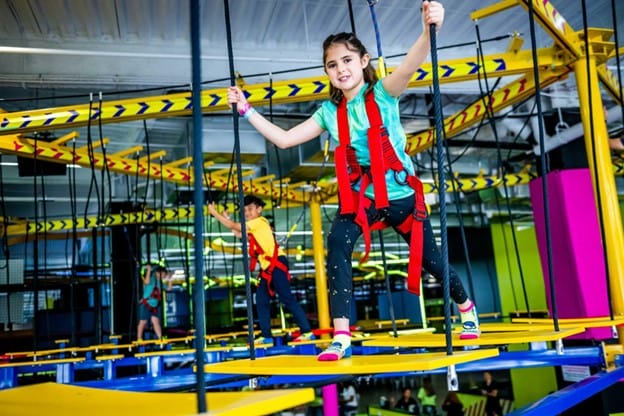 Gril walking on ropes