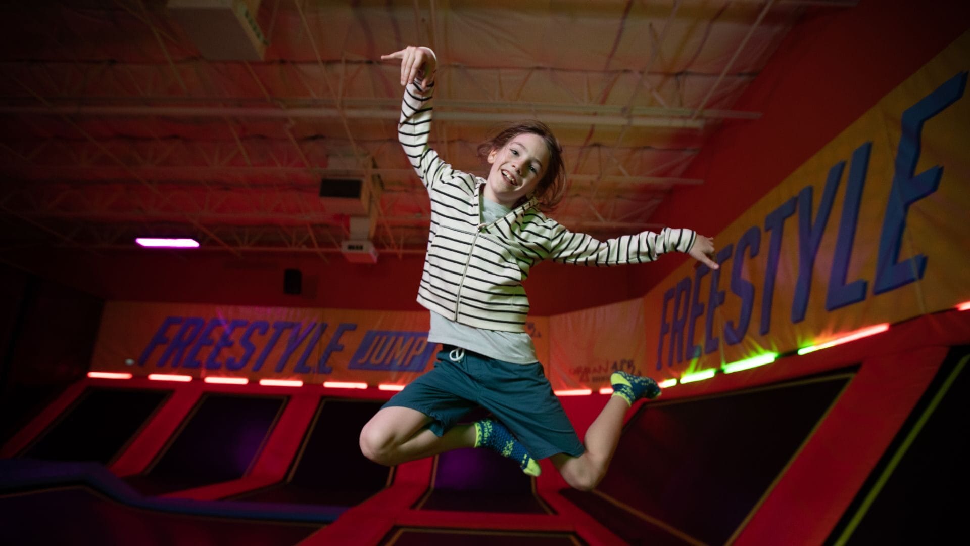 girl jumping on a trampoline at urban air