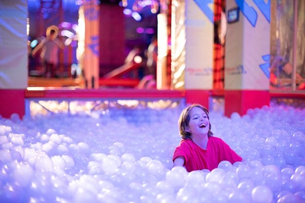 A young girl is playing in the urban air park