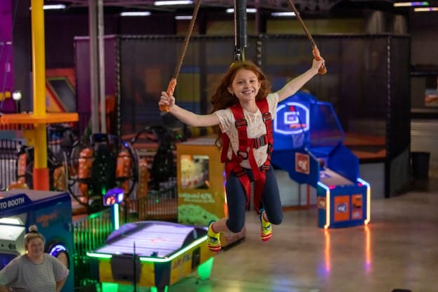 girl on urban air ropes course