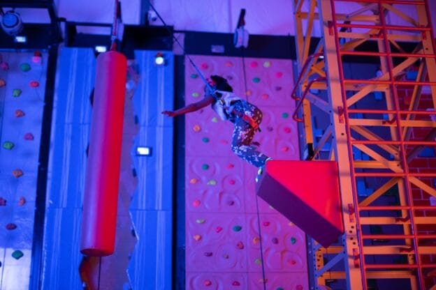 girl attempting the urban air leap of faith